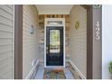 Inviting front door with decorative accents and a welcoming entrance at 425 Summit Trail Dr, Hillsborough, NC 27278