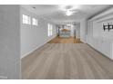 Expansive living area with carpet, built-in shelving, and ample natural light at 611 Atticus Way, Durham, NC 27703