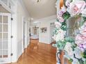 Inviting foyer with hardwood floors, decorative trim, and a view into the adjacent living spaces at 642 Bear Tree Creek, Chapel Hill, NC 27517