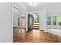 Elegant foyer with hardwood floors, an open doorway, and plenty of natural light at 101 Preston Arbor Ln, Cary, NC 27513