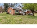 The beautiful home features a well-manicured lawn and charming architectural details at 101 W Thorndale Dr, Oxford, NC 27565