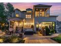 Spacious backyard featuring a patio with a hot tub, outdoor dining area, and covered porch at 104 Vervain Way, Holly Springs, NC 27540