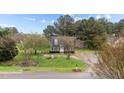 Attractive home with a well-maintained lawn, mature trees, and a classic design at 120 Stillmeadow Dr, Louisburg, NC 27549