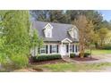 Inviting home showcasing classic architecture, neat landscaping, and a welcoming front entrance at 120 Stillmeadow Dr, Louisburg, NC 27549