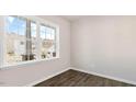 Bright room showcasing neutral walls, wood-look flooring, and a large window at 124 Pisgah St, Sanford, NC 27330