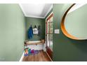 Inviting entryway with bench, hooks, and a stylish mirror at 1307 Crabapple Ln, Raleigh, NC 27607