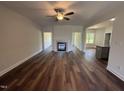 Bright living room featuring hardwood floors and a classic fireplace at 14 Cricket Hill Way, Benson, NC 27504