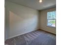 Bedroom featuring neutral-colored walls, carpet, and a bright window at 152 Parker Ln, Mebane, NC 27302