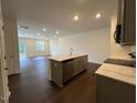 Modern kitchen featuring stainless steel appliances and center island at 158 Parker Ln, Mebane, NC 27302