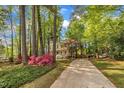 Beautiful yellow home with a charming porch and a long driveway at 1600 S Wade Ave, Garner, NC 27529