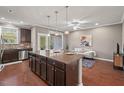 Well-lit kitchen with a center island and stainless steel appliances at 36 Argonaut Dr, Durham, NC 27705