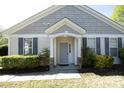 Inviting home exterior with a gray front door, sidelight windows, and gray shutters at 409 Courthouse Dr, Morrisville, NC 27560