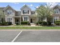 Charming townhouse with well-maintained landscaping, inviting curb appeal, and blossoming trees at 4210 Brynwood Ave, Durham, NC 27713