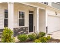 Close up of the home's front door and stone accents at 501 Willard Woods Dr, Wendell, NC 27591