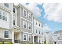 Eye-level townhome view highlighting the craftsman style and a meticulously landscaped front yard at 5217 Invention Way, Raleigh, NC 27616