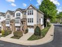 Lovely townhome with well manicured lawn, attached garage, and beautiful landscaping at 5702 Cameo Glass Way, Raleigh, NC 27612