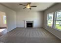 Inviting living room with carpet, a fireplace, and abundant natural light at 61 Heatherglenn Cir, Princeton, NC 27569
