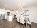 Bright dining area featuring modern lighting and stylish furniture at 67 Fern Ridge Dr, Cameron, NC 28326