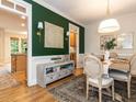 View of the dining room featuring hardwood floors, elegant decor, and an open layout at 6909 Clear Sailing Ln, Raleigh, NC 27615