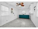 Room with white walls, tile floors, a ceiling fan and built in green cabinets at 7110 Hunter Hill Rd, Rocky Mount, NC 27804