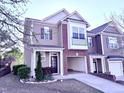 Inviting two-story townhome with a well-maintained lawn and attached one car garage at 743 Silver Stream Ln, Cary, NC 27519