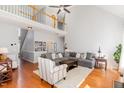 Spacious living room showcasing hardwood floors, an upper level view, and a cozy seating area at 756 Rockville Rd, Wake Forest, NC 27587