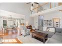 Bright and airy living room boasts hardwood floors, high ceilings, and seamless flow into the dining area at 756 Rockville Rd, Wake Forest, NC 27587
