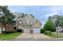 Inviting two-story home with a two-car garage and manicured landscaping at 9531 Vira Dr, Raleigh, NC 27617
