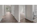 Bright hallway with hardwood floors leading to the bedrooms and bathroom at 1014 Middlecrest Dr, Rocky Mount, NC 27804