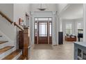 Bright entryway with a staircase and a classic door with sidelights at 1512 Piazzo Ct, Apex, NC 27502