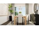 Dining area featuring a wood table, upholstered chairs, chandelier, and neutral decor at 1572 Bright Coral Trl, Wendell, NC 27591