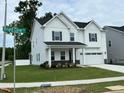 Charming two-story home with a well-maintained lawn and landscaping, located on the corner of Bright Coral at 1572 Bright Coral Trl, Wendell, NC 27591