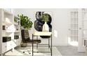 Bright office with modern desk, decorative plant, and artwork creating a productive workspace at 1572 Bright Coral Trl, Wendell, NC 27591