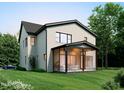 View of a modern home with a screened-in porch, perfect for outdoor entertaining at 406 Columbia Dr, Raleigh, NC 27604