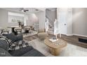 Cozy living room with open floor plan, hardwood floors, and natural light, leading to the staircase at 5505 Crabtree Park Ct, Raleigh, NC 27612