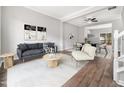 Inviting living room with stylish furniture, a ceiling fan, and an open layout to dining area at 5505 Crabtree Park Ct, Raleigh, NC 27612