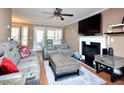 Cozy living room features a fireplace, comfortable seating, and natural light from the french doors at 600 Old Farm Rd Rd, Graham, NC 27253