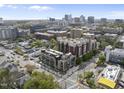 Elevated view showcasing city apartments, businesses, and residential areas, with city skyline at 615 W Peace St # 201, Raleigh, NC 27605