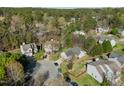 An aerial view of a neighborhood with well-maintained homes, lush trees, and manicured lawns at 616 Branchview Dr, Durham, NC 27713