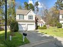 Traditional two-story home with a two-car garage and well-manicured lawn at 616 Branchview Dr, Durham, NC 27713