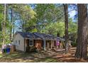 Side view of a single-story home with brick accents and a well-maintained lawn at 812 Northclift Dr, Raleigh, NC 27609