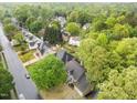 Serene aerial view of lush neighborhood, showcasing mature trees surrounding well-maintained homes at 8921 Walking Stick Trl, Raleigh, NC 27615