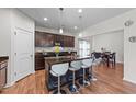 Open concept kitchen has an island, stainless steel appliances, and overlooks the dining area at 95 Shady Creek Trl, Garner, NC 27529