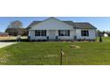 Inviting single-story home with a manicured lawn and appealing traditional facade at 99 Pate Landing Dr, Selma, NC 27576