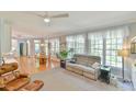 Relaxing living room with large windows, comfortable seating, and views to the breakfast nook at 104 Buckeye Ln, Chapel Hill, NC 27516