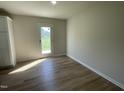 Bright dining area features wood-look floors and a glass door for access to the outdoors at 108 Pate Landing Dr, Selma, NC 27576