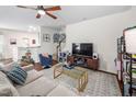 Comfortable living room featuring a ceiling fan and stylish decor at 1103 Kudzu St, Durham, NC 27713