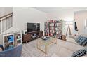 Cozy living room features stylish furniture and ample shelving for books and decor at 1103 Kudzu St, Durham, NC 27713