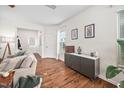 Bright living room featuring hardwood floors, modern furniture, and natural light at 1103 Kudzu St, Durham, NC 27713