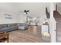 Spacious living room featuring hardwood floors and ample natural light with an open concept to the kitchen at 1110 Bent Willow Dr, Durham, NC 27704